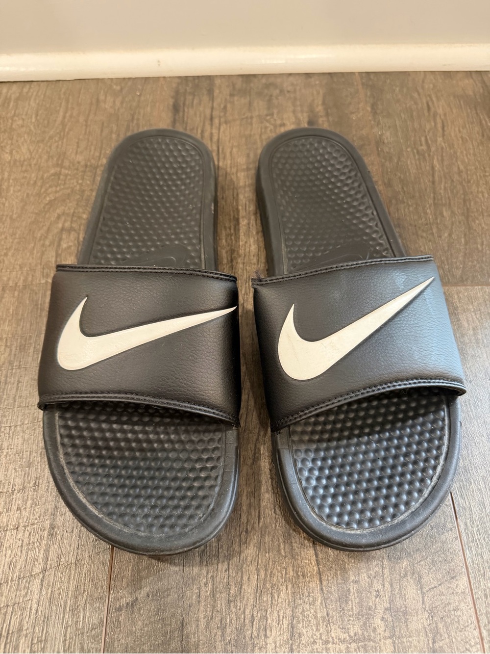 Nike Black Slides with White Swoosh Logo